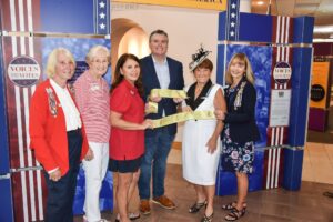 Cutting ribbon on our patriotic display